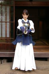 Rule 34 | 1girl, asian, foreshortening, gloves, hakama, hakama skirt, highres, japanese clothes, kendo, photo (medium), shinai, skirt, solo, sword, weapon