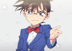 1boy, arm at side, bangs, black-framed eyewear, blazer, blurry, bow, bowtie, brown hair, child, closed mouth, collared shirt, commentary request, depth of field, edogawa conan, fingernails, glasses, grey background, jacket, k (gear labo), looking at viewer, male focus, meitantei conan, outstretched hand, puzzle piece, reaching out, red bow, red neckwear, shirt, short hair, simple background, smile, solo, upper body, white shirt, wind