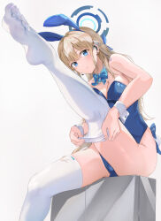 Rule 34 | 1girl, absurdres, animal ears, aqua bow, aqua bowtie, bare shoulders, blonde hair, blue archive, blue bow, blue eyes, blue hairband, blue leotard, bow, bowtie, braid, breasts, cleavage, commentary, detached collar, earpiece, fake animal ears, fake tail, hairband, halo, highleg, highleg leotard, highres, leg up, leotard, long hair, medium breasts, mosta (lo1777789), no shoes, official alternate costume, official alternate hairstyle, parted lips, playboy bunny, rabbit ears, rabbit tail, simple background, sitting, soles, solo, strapless, strapless leotard, symbol-only commentary, tail, thighhighs, thighhighs pull, thighs, toki (blue archive), toki (bunny) (blue archive), very long hair, white background, white thighhighs, white wrist cuffs, wrist cuffs