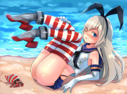 Rule 34 | 10s, 1girl, ass, bad id, bad pixiv id, beach, blonde hair, blue eyes, elbow gloves, gloves, kantai collection, kyuuso inukami, legs up, long hair, looking at viewer, one eye closed, outdoors, sand, shimakaze (kancolle), solo, striped clothes, striped thighhighs, thighhighs, water, wink
