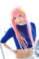 Rule 34 | 1girl, asian, blue eyes, blurry, braid, breasts, color contacts, cosplay, depth of field, hands on own hips, head tilt, indoors, light smile, looking at viewer, makeup, mascara, midriff, namada, nono (top wo nerae 2!), photo (medium), pink hair, side braid, sidelocks, small breasts, solo, standing, sweater, top wo nerae 2!