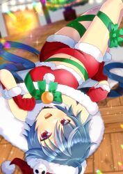Rule 34 | 1girl, :d, blue hair, blurry, blurry background, blush, bow, christmas tree, commentary request, crop top, depth of field, fang, fireplace, fur-trimmed gloves, fur-trimmed headwear, fur-trimmed shorts, fur trim, gloves, green bow, grey hair, hair between eyes, hat, idol corp, indoors, kou hiyoyo, long hair, lying, midriff, multicolored hair, navel, on back, on floor, open mouth, red eyes, red gloves, red hat, red shorts, santa costume, santa hat, short shorts, shorts, smile, solo, streaked hair, upside-down, very long hair, virtual youtuber, wooden floor, yuko yurei
