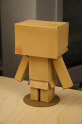 Rule 34 | box, cardboard box, danboo, figure, full body, highres, minimized, photo (medium), revoltech, standing, switch, yotsubato!