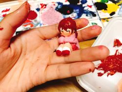 Rule 34 | 1girl, braid, brown hair, clay, commentary request, highres, holding, long sleeves, looking to the side, madotsuki, outo eguchi, paint, painting (medium), pink shirt, red eyes, red footwear, sculpture, shirt, sitting, socks, solo, traditional media, twin braids, unconventional media, white socks, yume nikki