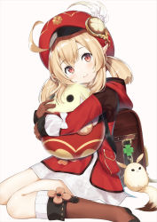 Rule 34 | 1girl, ahoge, backpack, bag, blonde hair, blush, bow, brown footwear, brown gloves, cabbie hat, charm (object), closed mouth, commentary request, dress, fuji noyume, genshin impact, gloves, hat, hat feather, highres, klee (genshin impact), long hair, long sleeves, looking at viewer, low twintails, pointy ears, red dress, red eyes, red hat, simple background, sitting, smile, solo, stuffed animal, stuffed toy, twintails, wariza, white background, white bow
