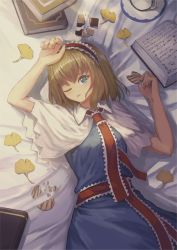 Rule 34 | 1girl, alice margatroid, arms up, bad id, bad pixiv id, blonde hair, blue dress, blue eyes, book, book stack, capelet, checkerboard cookie, cookie, cowboy shot, cup, dress, food, ginkgo leaf, hairband, hand on own forehead, highres, holding, holding cookie, holding food, leaf, lolita hairband, looking at viewer, lying, on back, on bed, one eye closed, ookashippo, open book, parted lips, sash, saucer, short hair, solo, teacup, touhou, white capelet