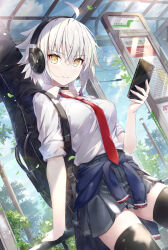 1girl ahoge black_choker breasts choker fate/grand_order fate_(series) gabiran guitar guitar_case headphones highres holding holding_phone instrument instrument_case jeanne_d&#039;arc_alter_(fate) large_breasts looking_at_viewer necktie phone pleated_skirt red_necktie school_uniform shirt short_hair skirt smile solo thighhighs unworn_sweater white_hair white_shirt yellow_eyes