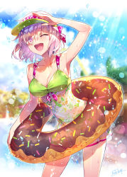 Rule 34 | 1girl, alternate costume, armpits, bare shoulders, bikini, blurry, blurry background, blush, breasts, cleavage, collarbone, contrapposto, cowboy shot, doughnut innertube, dress swimsuit, eyes visible through hair, fate/grand order, fate (series), floral print, green bikini, hair over one eye, hand up, highres, innertube, large breasts, lens flare, light purple hair, light rays, looking at viewer, mash kyrielight, navel, one eye closed, open mouth, outdoors, purple eyes, redrop, shading eyes, short hair, signature, smile, solo, sparkle, sunbeam, sunlight, swim ring, swimsuit, thighs, visor cap, water, wet