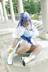 Rule 34 | 1girl, ankle boots, asian, blue eyes, blue hair, boots, bow, bracelet, breasts, choker, chouzuki maryou, cosplay, cure diamond, cure diamond (cosplay), dokidoki! precure, dress, headpiece, highres, jewelry, large breasts, long hair, magical girl, matching hair/eyes, photo (medium), plump, ponytail, precure, puffy short sleeves, puffy sleeves, ribbon, short sleeves, sitting, solo, tiara