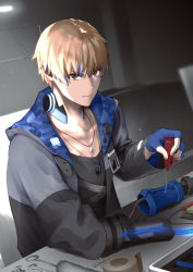 Rule 34 | 1boy, black jacket, black shirt, blonde hair, blue eyes, blue gloves, camouflage, camouflage jacket, closed mouth, dog tags, gloves, hair between eyes, holding, indoors, jacket, jewelry, lee: entropy (punishing: gray raven), lee (punishing: gray raven), long sleeves, looking at viewer, necklace, punishing: gray raven, sachiko y, shirt, short hair, smile, solo, table, v-shaped eyebrows