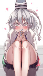 Rule 34 | 1girl, @ @, absurdres, bare legs, blush, commentary request, eyelashes, eyes visible through hair, feet out of frame, fingernails, grey eyes, grey hair, hair between eyes, hand to own mouth, hands up, hat, heart, highres, japanese clothes, kariginu, knees up, legs, long hair, long sleeves, looking at viewer, mahoro (minase mahoro), mononobe no futo, nail polish, own hands together, ponytail, sitting, skirt, solo, staring, tate eboshi, touhou, wide-eyed