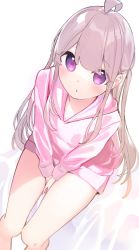 1girl, :o, ahoge, bangs, between legs, blush, brown hair, chikuwa., commentary request, eyebrows visible through hair, feet out of frame, from above, hair between eyes, hand between legs, highres, hood, hood down, hoodie, long hair, long sleeves, looking at viewer, looking up, original, parted lips, pink hoodie, purple eyes, sitting, solo, sweat, two side up, very long hair, white background