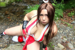 Rule 34 | breasts, brown eyes, brown hair, chouzuki maryou, cosplay, hair ornament, hand fan, hanging breasts, large breasts, long hair, photo (medium), plump, ponytail, shiranui mai, shiranui mai (cosplay), snk, the king of fighters, thick thighs, thighs, very long hair