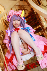 Rule 34 | 1girl, asian, cosplay, crescent, dress, female focus, hat, long hair, patchouli knowledge, photo (medium), purple hair, solo, stairs, tenshi myu, touhou