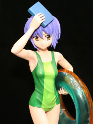 Rule 34 | 00s, 1girl, arm up, armpits, black background, book, breasts, brown eyes, casual one-piece swimsuit, covered navel, cowboy shot, crossed legs, figure, green one-piece swimsuit, hand up, holding, innertube, looking at viewer, looking to the side, medium breasts, nagato yuki, one-piece swimsuit, photo (medium), purple hair, short hair, sidelocks, simple background, solo, standing, suzumiya haruhi no yuuutsu, swim ring, swimsuit, wide hips, wonder festival, wonder festival 2007