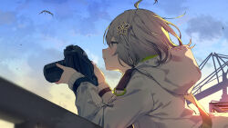 Rule 34 | 1girl, against railing, arknights, bird, camera, from side, hair ornament, hairclip, highres, holding, holding camera, hood, hood down, long sleeves, outdoors, railing, scene (arknights), sky, solo, sunset, sutorora, upper body