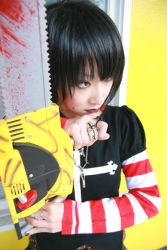 Rule 34 | 1girl, asian, black hair, black lagoon, chainsaw, cosplay, female focus, frederica sawyer, frederica sawyer (cosplay), goth fashion, jewelry, looking away, mole, omi gibson, photo (medium), plaid, pleated skirt, punk, red lips, ring, simple background, skirt, solo, striped, upper body, weapon, yellow background
