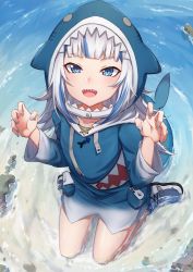 Rule 34 | 1girl, animal hood, beach, blue eyes, blue nails, blunt bangs, claw pose, fins, fish tail, from above, gawr gura, highres, hololive, hololive english, hood, jirofly, kneeling, looking at viewer, looking up, multicolored hair, nail polish, open mouth, sand, shark girl, shark hood, shark tail, sharp teeth, soaking feet, solo, streaked hair, tail, teeth, two-tone hair, upper teeth only, virtual youtuber, water