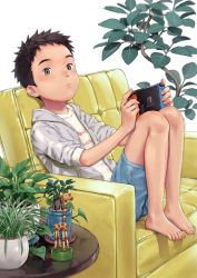 Rule 34 | 1boy, b gent, bare legs, barefoot, black hair, child, closed mouth, commentary request, couch, denim, denim shorts, feet, green eyes, handheld game console, indoors, jacket, looking at viewer, male focus, nintendo, nintendo switch, original, plant, potted plant, shirt, short hair, short sleeves, shorts, simple background, sitting, table, toes, toy, white background, white shirt