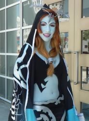 Rule 34 | blue skin, bodypaint, colored skin, cosplay, cosplay photo, cowboy shot, day, door, midna, midna (true), midriff, nintendo, outdoors, photo (medium), red eyes, reflection, solo, spoilers, standing, the legend of zelda, the legend of zelda: twilight princess