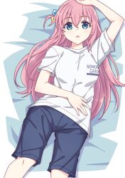 Rule 34 | 1girl, arm up, bed sheet, black shorts, blue eyes, blush, bocchi the rock!, breasts, clothes writing, cube hair ornament, e20, feet out of frame, gotoh hitori, grey shirt, hair between eyes, hair ornament, highres, long hair, lying, medium breasts, on back, one side up, parted lips, pink hair, shirt, short sleeves, shorts, solo, very long hair