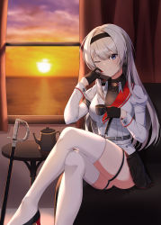 Rule 34 | absurdres, armband, azur lane, belt, black skirt, blue eyes, braid, breasts, clothes lift, collared shirt, couch, crossed legs, cup, curtains, garter straps, gloves, half gloves, hand on own cheek, hand on own face, headband, high heels, highres, holding, holding cup, jacket, large breasts, long hair, mainz (azur lane), one eye closed, pinky out, pleated skirt, saber (weapon), shirt, side braid, sidelocks, silver hair, sitting, skirt, skirt lift, solo, sunset, sword, table, teacup, teapot, thighhighs, uniform, weapon, white jacket, white thighhighs, window, yuzb