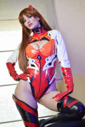 Rule 34 | 1girl, absurdres, adapted costume, argentine (nationality), bodysuit, breasts, brown hair, cleavage, cleavage cutout, clothing cutout, cosplay, curvy, hand on own hip, highleg, highleg leotard, highres, leotard, lips, long hair, looking at viewer, medium breasts, neon genesis evangelion, official alternate costume, photo (medium), plugsuit, rebuild of evangelion, red leotard, shiny clothes, simple background, skin tight, skindentation, solo, sophie valentine, souryuu asuka langley, souryuu asuka langley (cosplay), standing, thighhighs, thong leotard, wide hips