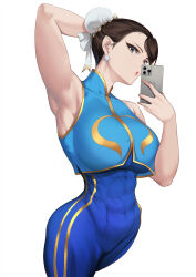 Rule 34 | 1girl, :o, arm behind head, armpits, bare arms, bare shoulders, blue unitard, blue vest, blueorca, bracelet, breasts, brown eyes, brown hair, bun cover, capcom, cellphone, chinese clothes, chun-li, covered navel, earrings, gold trim, hair bun, highres, holding, holding phone, jewelry, large breasts, looking at viewer, phone, selfie, short hair, smartphone, solo, spiked bracelet, spikes, street fighter, street fighter zero (series), thighs, toned, vest, white background