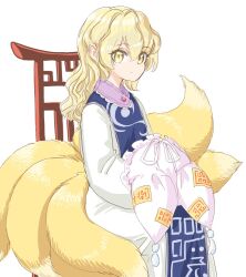 1girl blonde_hair blue_tabard closed_mouth commentary_request fox_tail hat holding holding_hat holding_unworn_clothes long_hair long_sleeves mob_cap multiple_tails no_animal_ears s-a-murai solo tabard tail touhou yakumo_ran yellow_eyes