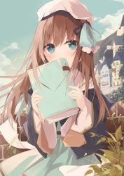 Rule 34 | 1girl, beret, black jacket, blue dress, blue eyes, blue sky, blush, book, brick wall, brown hair, building, cloud, commentary request, covered mouth, day, dress, hair between eyes, hands up, hat, highres, holding, holding book, jacket, kushida you, long hair, long sleeves, looking at viewer, mountain, original, outdoors, sky, sleeves past wrists, solo, very long hair, white hat, wide sleeves