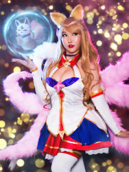 Rule 34 | 1girl, ahri (league of legends), asian, blonde hair, blue eyes, breasts, cleavage, cosplay, league of legends, magical girl, photo (medium), rinnie riot, star guardian (league of legends), star guardian ahri
