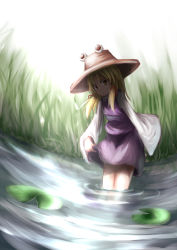 Rule 34 | 1girl, baram, blonde hair, clothes lift, dress, hat, lily pad, moriya suwako, partially submerged, skirt, skirt lift, solo, standing, touhou, wading, water