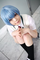 Rule 34 | 1girl, alternate costume, asian, ayanami rei, black socks, blue hair, breasts, color contacts, cosplay, dutch angle, from above, grey skirt, highres, indoors, looking at viewer, miniskirt, namada, necktie, neon genesis evangelion, on floor, photo (medium), pleated skirt, red eyes, red necktie, school uniform, shirt, shoes, short hair, short sleeves, sitting, skirt, small breasts, socks, solo, sweater vest, uwabaki, white footwear, white shirt