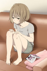 Rule 34 | 1girl, :t, barefoot, blush, book, brown eyes, brown hair, clothes writing, collarbone, couch, feet, fidgeting, full body, gradient background, green eyes, hands on own knees, indoors, mattaku mousuke, motion lines, open book, original, pout, shirt, short hair, short sleeves, shorts, sitting, solo, t-shirt
