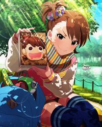 Rule 34 | 1girl, backpack, bag, brown eyes, brown hair, card (medium), evil smile, futami ami, holding, idolmaster, idolmaster million live!, idolmaster million live! theater days, official art, smile, solo, thighhighs, tree, water
