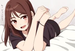 Rule 34 | 1girl, :d, barefoot, bed sheet, black shirt, black shorts, blush, brown eyes, brown hair, collarbone, commentary request, feet, foot out of frame, grey background, hands up, highres, kapatarou, long hair, looking at viewer, lying, on stomach, open mouth, original, own hands together, shirt, short sleeves, shorts, simple background, smile, soles, solo, thick eyebrows, toes, translation request, white nails