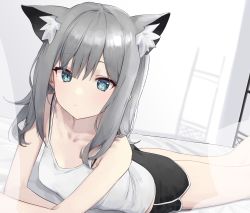 Rule 34 | 1girl, absurdres, animal ear fluff, animal ears, arm support, bare shoulders, bed, black shorts, blue archive, blue eyes, bra strap, breasts, camisole, closed mouth, commentary, dolphin shorts, dot nose, feet out of frame, green eyes, grey hair, highres, long hair, looking at viewer, lying, mismatched pupils, on bed, on stomach, shiroko (blue archive), shirt, short shorts, shorts, sidelocks, small breasts, solo, syhan, white shirt