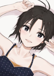 Rule 34 | 1girl, antenna hair, armpits, bare shoulders, black camisole, black eyes, black hair, camisole, close-up, commentary, drop shadow, dutch angle, hair between eyes, hands up, highres, idolmaster, idolmaster (classic), idolmaster 2, idolmaster million live!, idolmaster million live! theater days, kikuchi makoto, light blush, looking at viewer, lying, mogskg, on back, orange camisole, parted lips, polka dot, polka dot camisole, short hair, smile, solo, undershirt