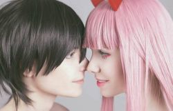 Rule 34 | 10s, 1boy, 1girl, black hair, blue eyes, cosplay, couple, darling in the franxx, face-to-face, facing another, forehead-to-forehead, green eyes, heads together, hetero, hiro (darling in the franxx), hiro (darling in the franxx) (cosplay), horns, long hair, looking at another, oni horns, photo (medium), pink hair, red horns, topless male, zero two (darling in the franxx), zero two (darling in the franxx) (cosplay)