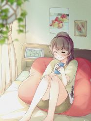 Rule 34 | 1girl, bed, bedroom, blunt bangs, blurry, blurry foreground, blush, brown hair, brown shirt, brown shorts, clock, closed eyes, commentary, cushion, hair tuft, happy, highres, holding, holding phone, indoors, knees up, long hair, love live!, love live! school idol project, minami kotori, on bed, phone, picture frame, poster (object), satisfaction-zero, shade, shirt, short sleeves, shorts, sitting, smile, solo