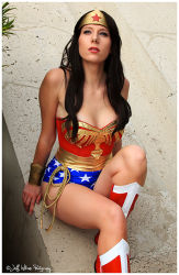 Rule 34 | 1girl, amazon warrior, boots, bracelet, constantine in tokyo, cosplay, dc comics, jewelry, lasso, leotard, lipstick, long hair, makeup, parted lips, photo (medium), red footwear, shoes, sitting, sleeveless, solo, star (symbol), strapless, tiara, wonder woman, wonder woman (series)