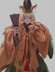 Rule 34 | 1girl, adapted costume, blonde hair, cowboy shot, folding fan, grey background, hand fan, hat, highres, holding, kijima (amayadori-tei), long hair, long sleeves, looking at viewer, matara okina, parted lips, simple background, smile, solo, tabard, touhou, wide sleeves