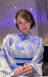 Rule 34 | 1girl, breasts, brown eyes, brown hair, female focus, flower hair ornament, indoors, japanese (nationality), japanese clothes, kimono, large breasts, looking at viewer, mole, photo (medium), short hair, smile, solo, yoshikawa aimi