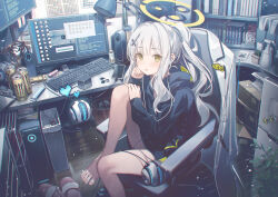 Rule 34 | 1girl, barefoot, black hoodie, blue archive, blush, can, cellphone, chair, green eyes, green halo, grey hair, halo, hare (blue archive), highres, hood, hoodie, kaerunoko, computer keyboard, long hair, long sleeves, monitor, monster energy, open mouth, phone, ponytail, sitting, smartphone, solo