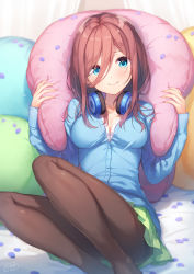 Rule 34 | 1girl, blue cardigan, blue eyes, blush, breasts, brown hair, brown pantyhose, buttons, cardigan, cleavage, closed mouth, commentary request, go-toubun no hanayome, green skirt, hair between eyes, head tilt, headphones, headphones around neck, highres, holding, knees up, long hair, long sleeves, looking at viewer, medium breasts, miniskirt, nakano miku, nijihashi sora, no shoes, pantyhose, partially unbuttoned, petals, pillow, pleated skirt, reclining, school uniform, shirt, sidelocks, signature, sitting, skirt, smile, solo, white shirt