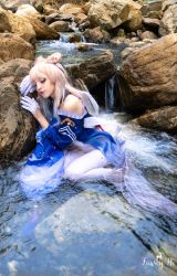 Rule 34 | 1girl, absurdres, blonde hair, blue dress, blue gloves, blue hair, clothing cutout, cosplay, cosplay photo, dress, eyeliner, genshin impact, gloves, highres, looking down, makeup, milky way01, multicolored hair, pantyhose, parted lips, photo (medium), rock, sangonomiya kokomi, sangonomiya kokomi (cosplay), shoulder cutout, solo, streaked hair, water, white pantyhose