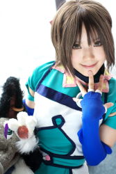 Rule 34 | 1girl, asian, blue gloves, branky, breasts, brown eyes, brown hair, cosplay, elbow gloves, fingerless gloves, gensou suikoden, gensou suikoden iii, gloves, highres, indoors, kipi-san, looking at viewer, mel, mel (cosplay), mole, photo (medium), puppet, short hair, small breasts, smile, stuffed animal, stuffed toy
