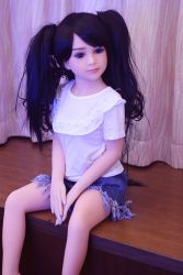 Rule 34 | 1girl, black hair, doll, highres, long hair, photo (medium), sitting, solo, tagme