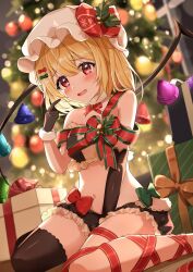 Rule 34 | 1girl, absurdres, black gloves, black thighhighs, blonde hair, blush, bow, box, breasts, christmas, christmas ornaments, christmas tree, fang, flandre scarlet, gift, gift box, gloves, green bow, hair bow, hat, highres, long hair, looking at viewer, mob cap, navel, one side up, open mouth, red bow, red eyes, red ribbon, ribbon, single thighhigh, small breasts, solo, thighhighs, touhou, wheat retzel, white hat, wings