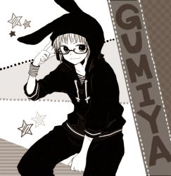 Rule 34 | 1boy, animal hood, anzu (o6v6o), between legs, rabbit hood, character name, drawstring, finger to head, genderswap, genderswap (ftm), glasses, greyscale, gumiya, hand between legs, hood, hood up, hoodie, long sleeves, looking at viewer, male focus, monochrome, pants, sitting, smile, solo, star (symbol), vocaloid, wristband